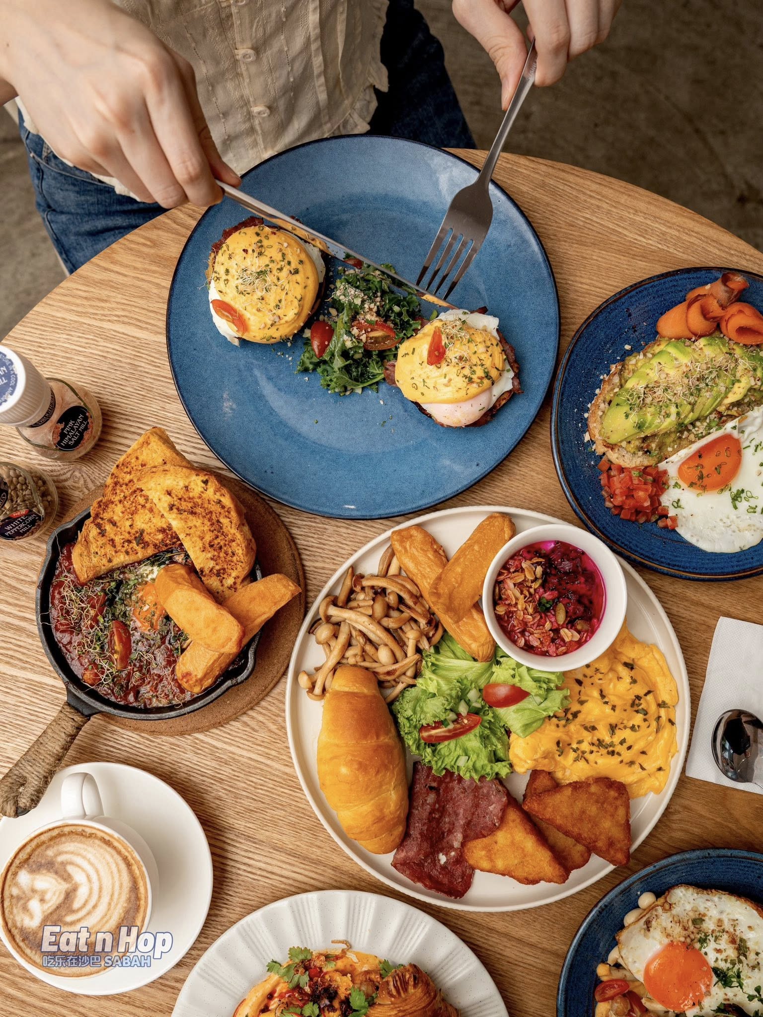 Fika brunch spread with eggs benedict and avocado toast