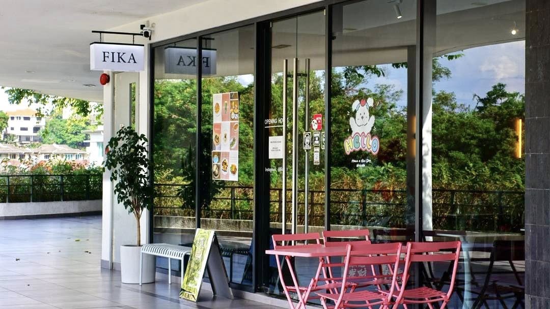 Fika café pink counter with baristas