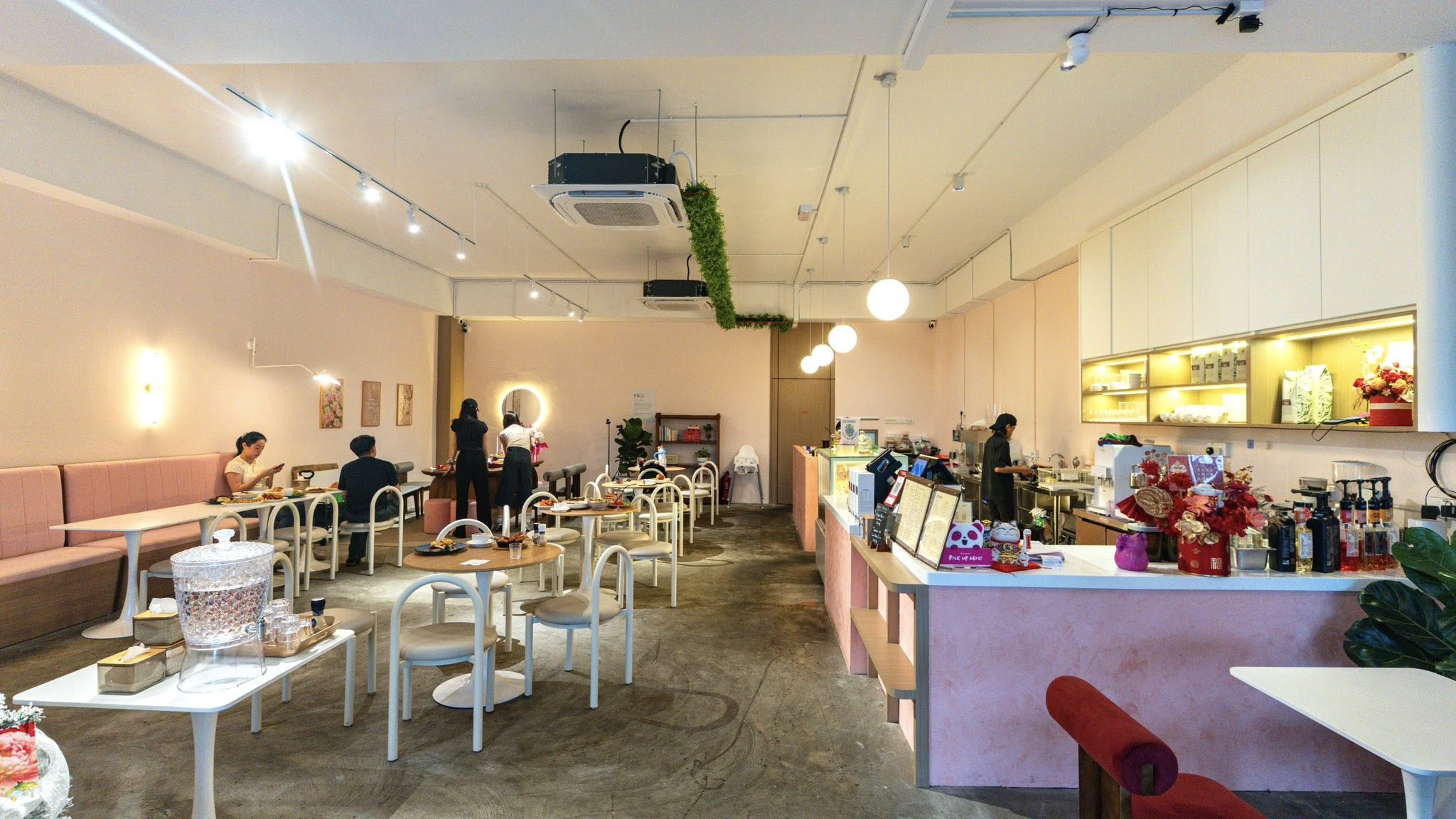 Fika @ JTT café interior — warm pink and white minimalist space