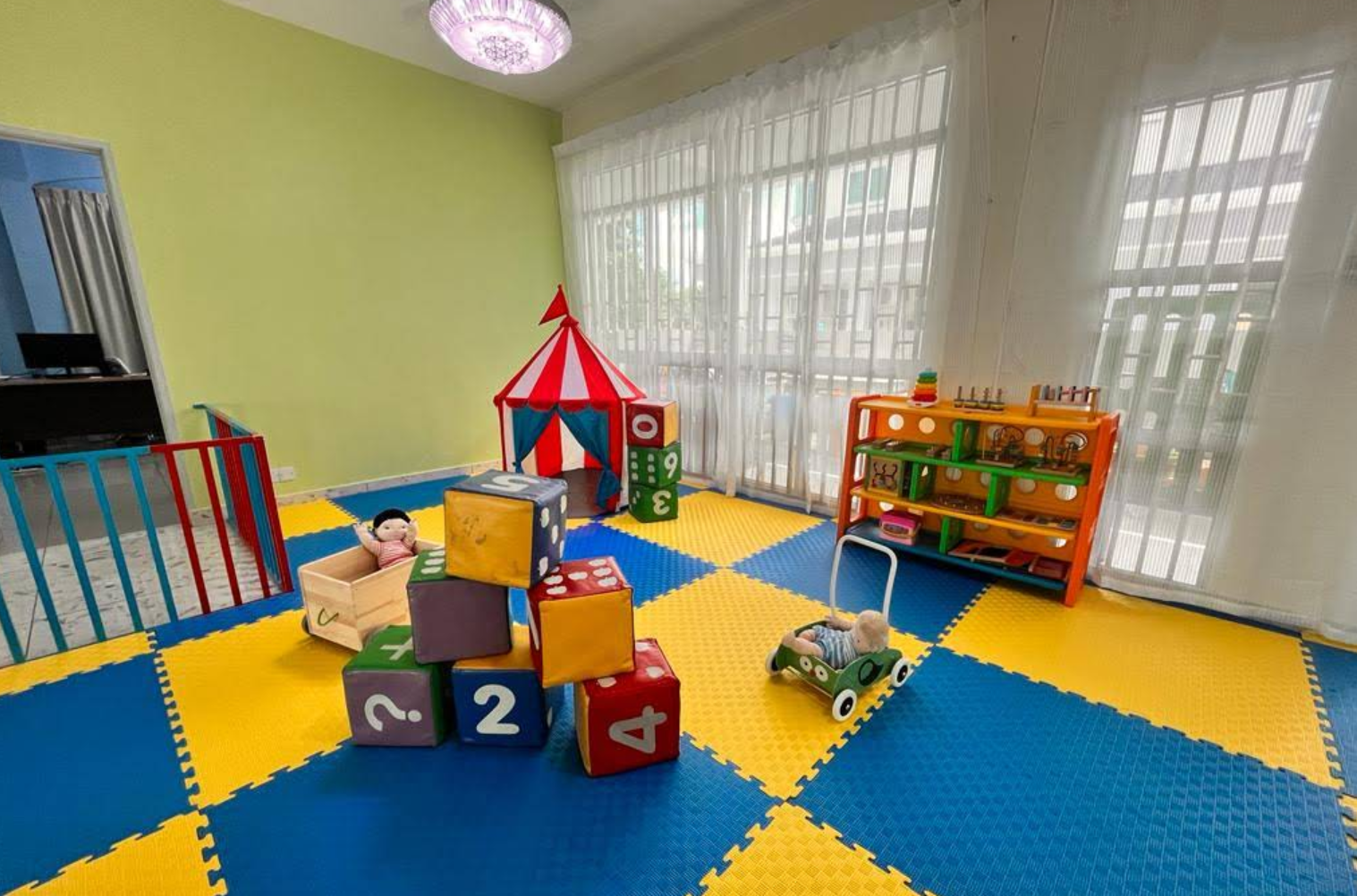 Colorful play room with learning blocks at Happy Tree House